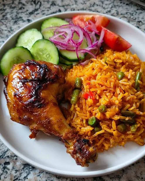 Nigerian jollof rice and local soup plated at Taste of Africa Restaurant